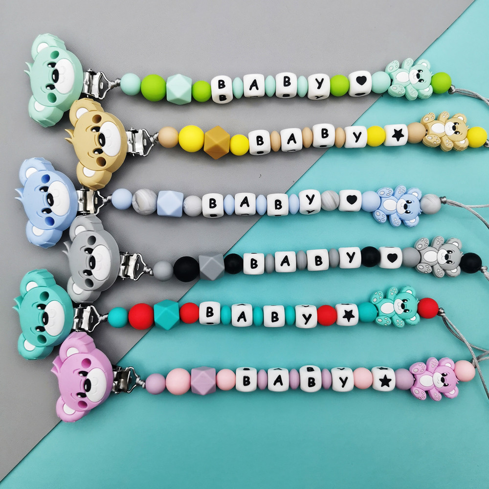 数字と文字でパーソナライズされたシリコンおしゃぶりクリップ, - Baby Teethers のレビューと価格