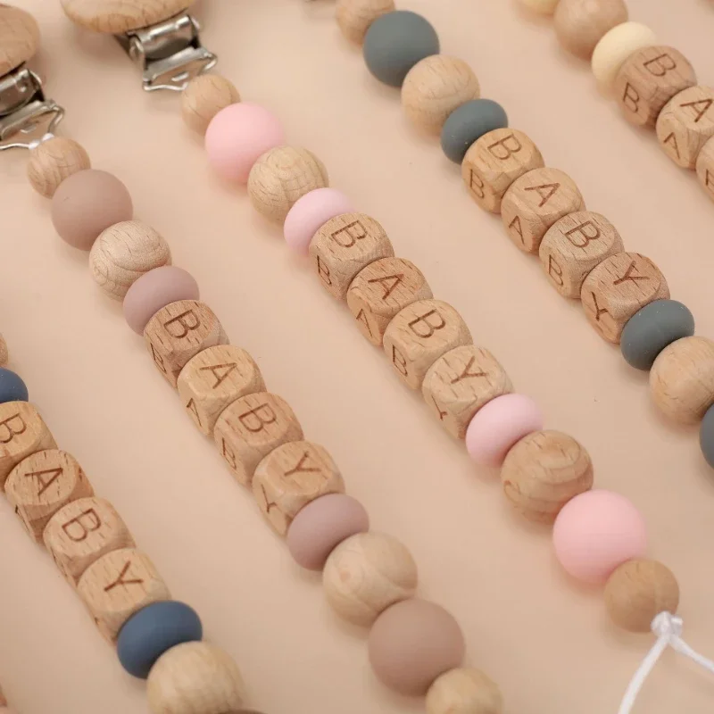 パーソナライズされた赤ちゃんのおしゃぶりクリップ,名前のおし - Baby Teethers のレビューと価格